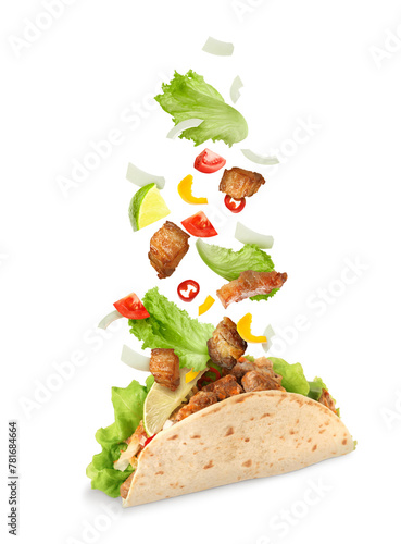 Delicious taco with flying ingredients on white background © New Africa