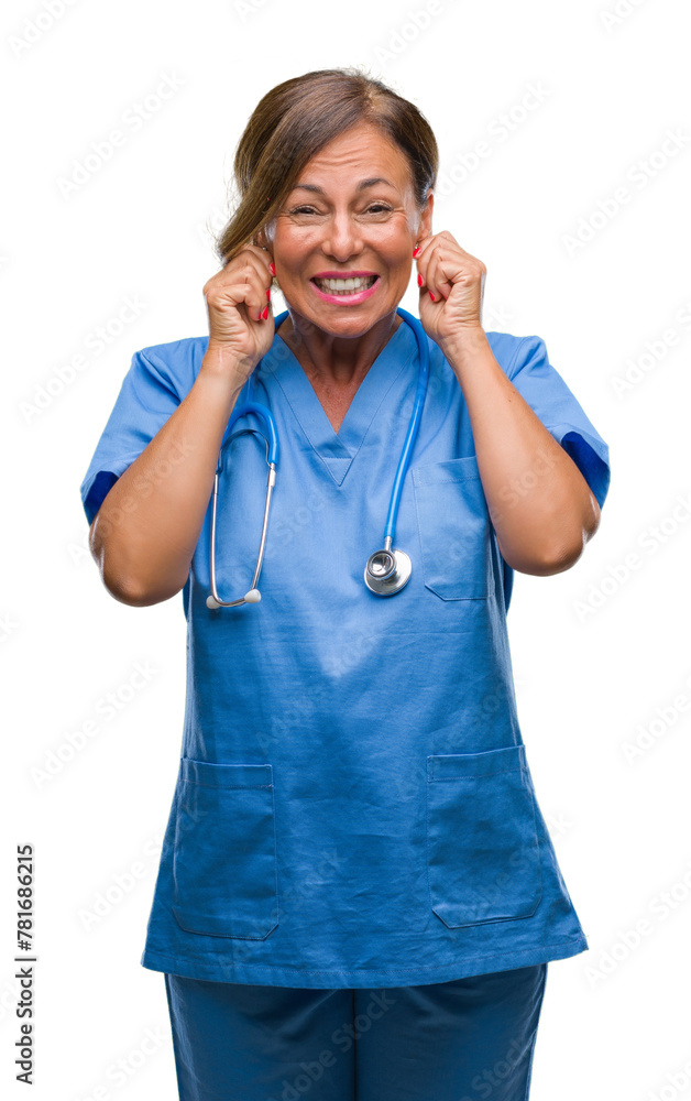 Middle age senior nurse doctor woman over isolated background covering ears with fingers with annoyed expression for the noise of loud music. Deaf concept. Middle age senior nurse doctor woman over isolated background covering ears with fingers with annoyed expression for the noise of loud music. Deaf concept.