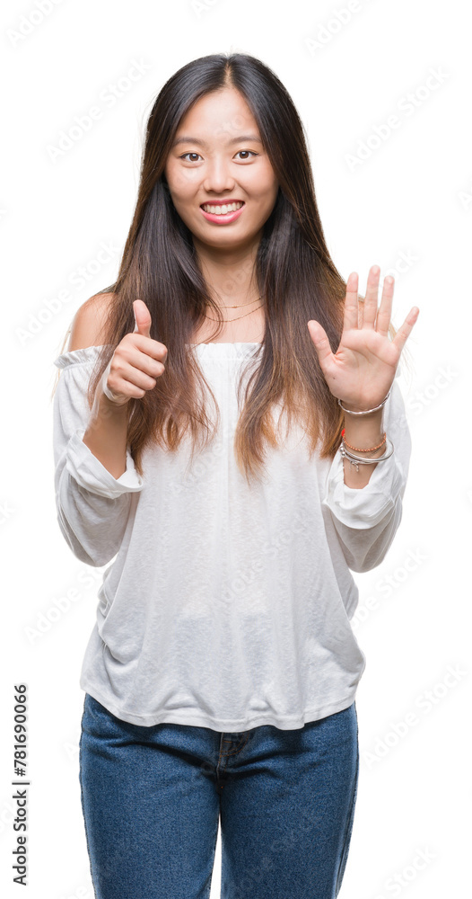 Young asian woman over isolated background showing and pointing up with fingers number six while smiling confident and happy. Young asian woman over isolated background showing and pointing up with fingers number six while smiling confident and happy.