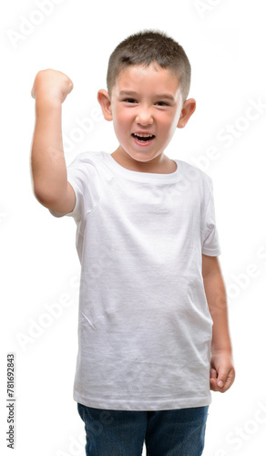 Dark haired little child annoyed and frustrated shouting with anger, crazy and yelling with raised hand, anger concept