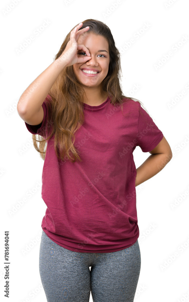 Young beautiful brunette woman over isolated background doing ok gesture with hand smiling, eye looking through fingers with happy face. Young beautiful brunette woman over isolated background doing ok gesture with hand smiling, eye looking through fingers with happy face.