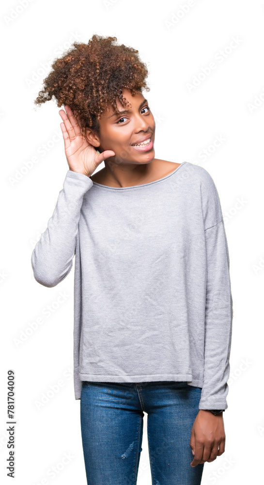 Beautiful young african american woman over isolated background smiling with hand over ear listening an hearing to rumor or gossip. Deafness concept. Beautiful young african american woman over isolated background smiling with hand over ear listening an hearing to rumor or gossip. Deafness concept.
