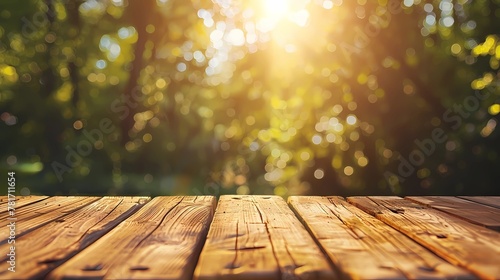 Empty wooden table space with forest blurred background and sun light
