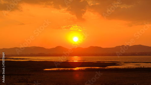 Bright beautiful sunrise or sunset at lake