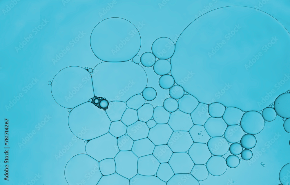 Serum oil droplets on water surface to create bubbles pattern and beauty wallpaper background. Serum oil droplets on water surface to create bubbles pattern and beauty wallpaper background.