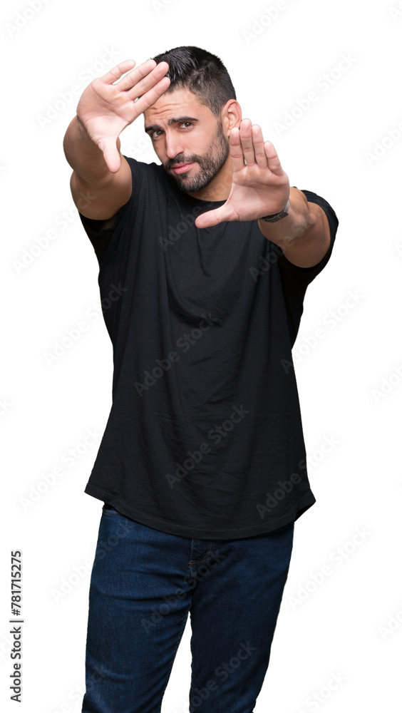 Young handsome man over isolated background Smiling doing frame using hands palms and fingers, camera perspective Young handsome man over isolated background Smiling doing frame using hands palms and fingers, camera perspective