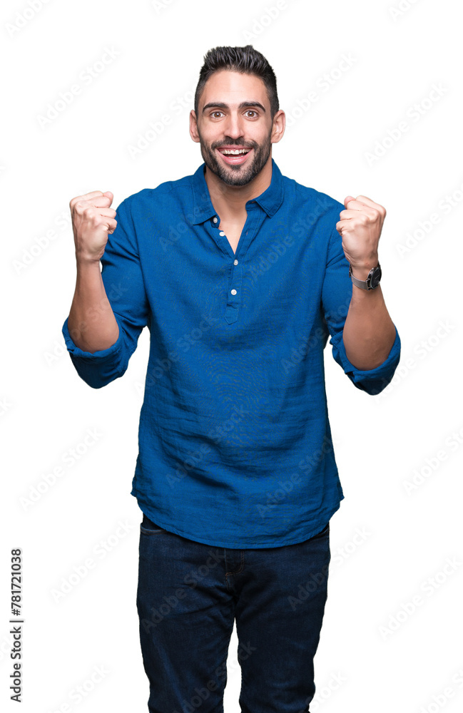 Fototapeta premium Young handsome man over isolated background celebrating surprised and amazed for success with arms raised and open eyes. Winner concept.