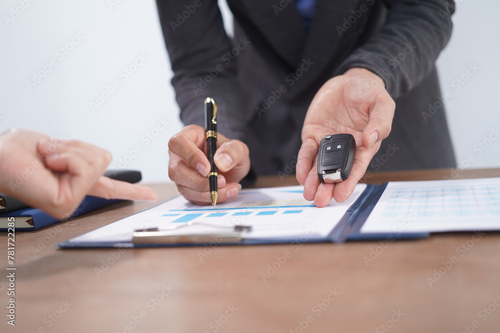 Agent Assurance Securing Deals with Confidence close up man working with car contract document or lease paper at desk in loan car office. Agent Assurance Securing Deals with Confidence close up man working with car contract document or lease paper at desk in loan car office.