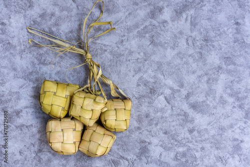 Isolated Ketupat Lebaran. Eid celebratory dish of rice cake or Lebaran menu, Ketupat. Food Festive for Family in Indonesian or Malaysia Moslem Culture. Made from young coconut leaves photo