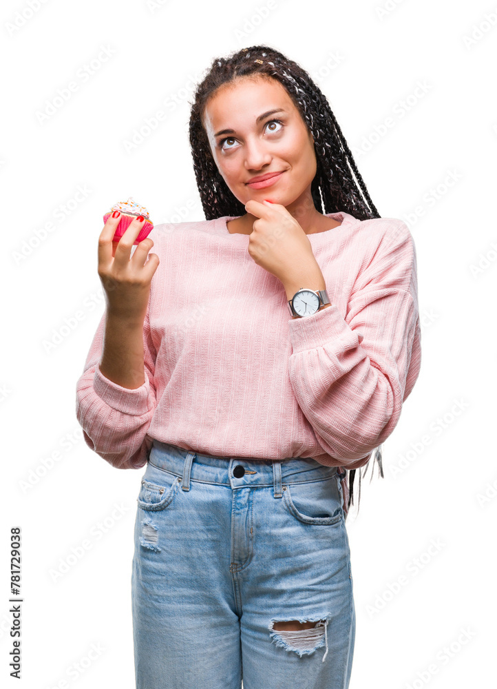 Young african american girl eating cupcake over isolated background serious face thinking about question, very confused idea Young african american girl eating cupcake over isolated background serious face thinking about question, very confused idea