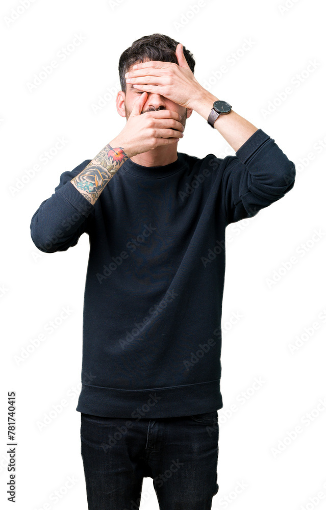 Young handsome man over isolated background Covering eyes and mouth with hands, surprised and shocked. Hiding emotion Young handsome man over isolated background Covering eyes and mouth with hands, surprised and shocked. Hiding emotion