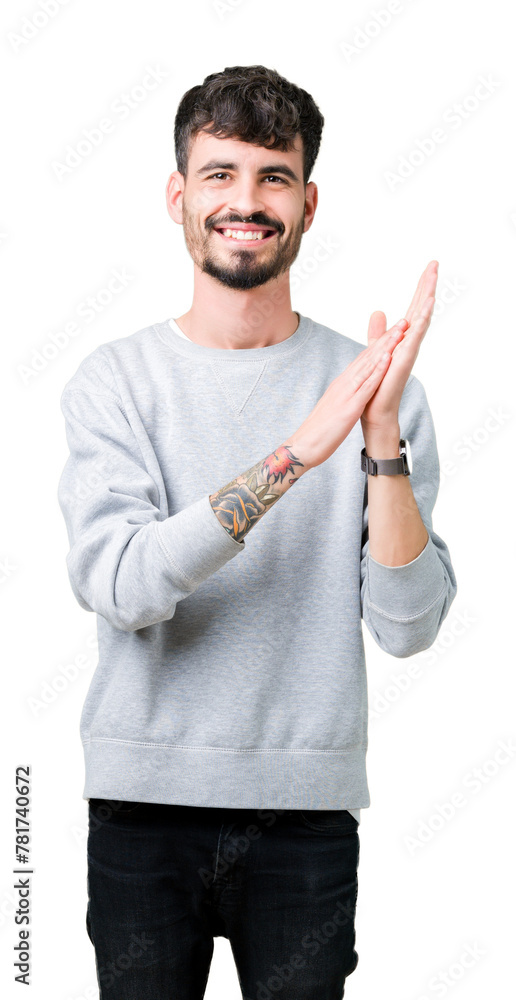 Young handsome man wearing sweatshirt over isolated background Clapping and applauding happy and joyful, smiling proud hands together Young handsome man wearing sweatshirt over isolated background Clapping and applauding happy and joyful, smiling proud hands together