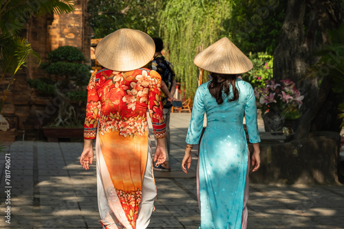 Vietnamese women in traditional ao dai dress in the village, rural area Nha Trang Vietnam
