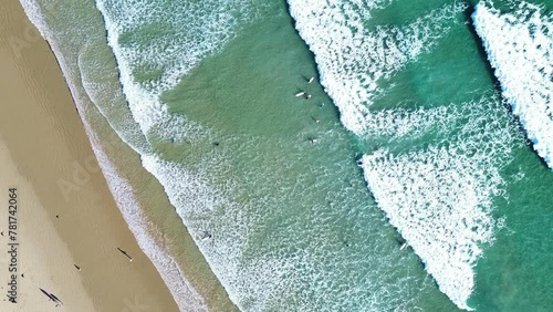 Surfer's at Norman beach, Wilsons Promotory, Victoria, Australia. Bird eye view with movement. photo