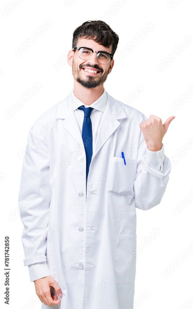 Young professional scientist man wearing white coat over isolated background smiling with happy face looking and pointing to the side with thumb up. Young professional scientist man wearing white coat over isolated background smiling with happy face looking and pointing to the side with thumb up.
