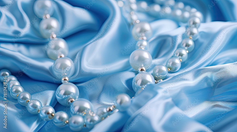 jewelry on blue satin background, closeup. jewelry on blue satin background, closeup.