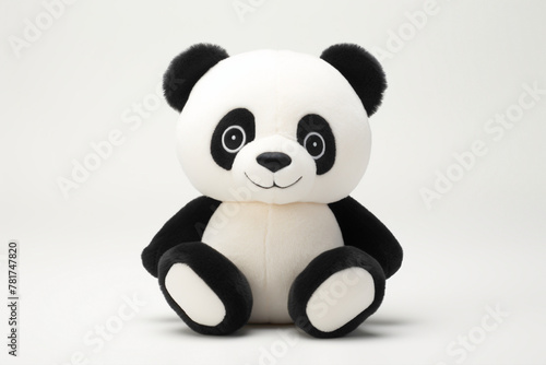 Adorable cartoonish panda toy, sitting against a clean white background, exuding cuddly charm and innocence. © Hunny
