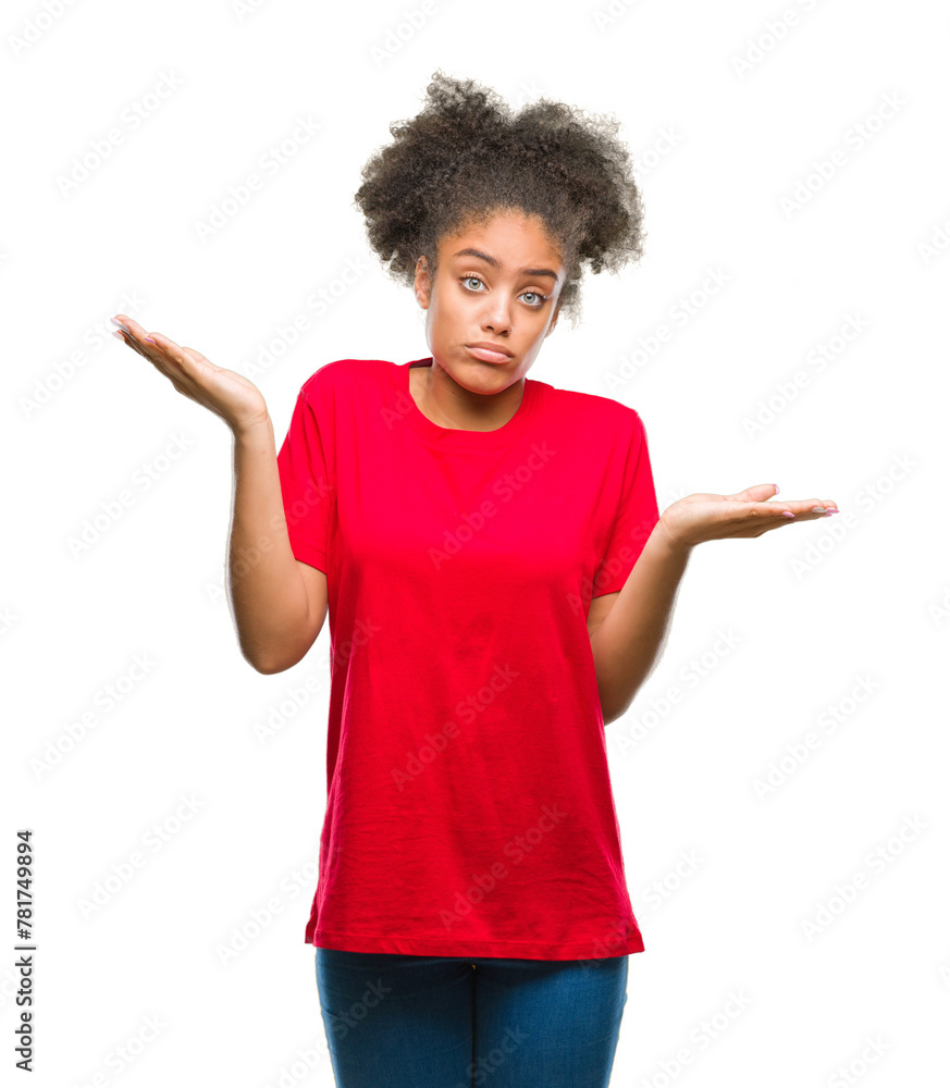Young afro american woman over isolated background clueless and confused expression with arms and hands raised. Doubt concept. Young afro american woman over isolated background clueless and confused expression with arms and hands raised. Doubt concept.