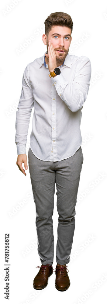 Young handsome business man hand on mouth telling secret rumor, whispering malicious talk conversation