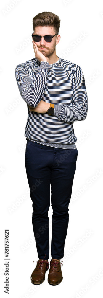 Young handsome man wearing sunglasses thinking looking tired and bored with depression problems with crossed arms. Young handsome man wearing sunglasses thinking looking tired and bored with depression problems with crossed arms.