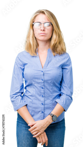 Beautiful young business woman over isolated background Relaxed with serious expression on face. Simple and natural looking at the camera.