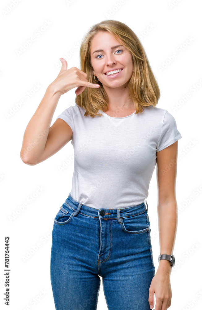 Beautiful young woman wearing casual white t-shirt over isolated background smiling doing phone gesture with hand and fingers like talking on the telephone. Communicating concepts. Beautiful young woman wearing casual white t-shirt over isolated background smiling doing phone gesture with hand and fingers like talking on the telephone. Communicating concepts.
