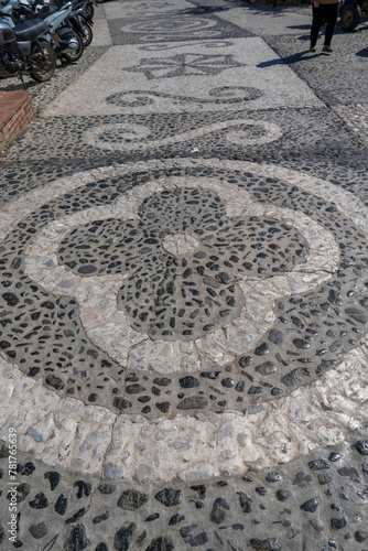 Detail of flower mosaic sidewalk pattern in Frigiliana 