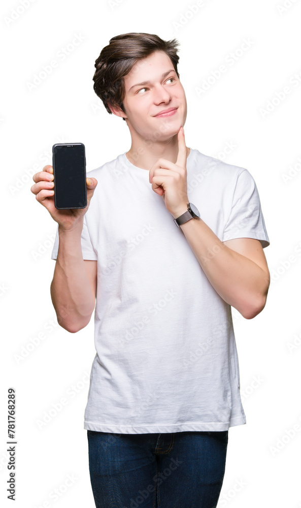 Young man showing smartphone screen over isolated background serious face thinking about question, very confused idea Young man showing smartphone screen over isolated background serious face thinking about question, very confused idea