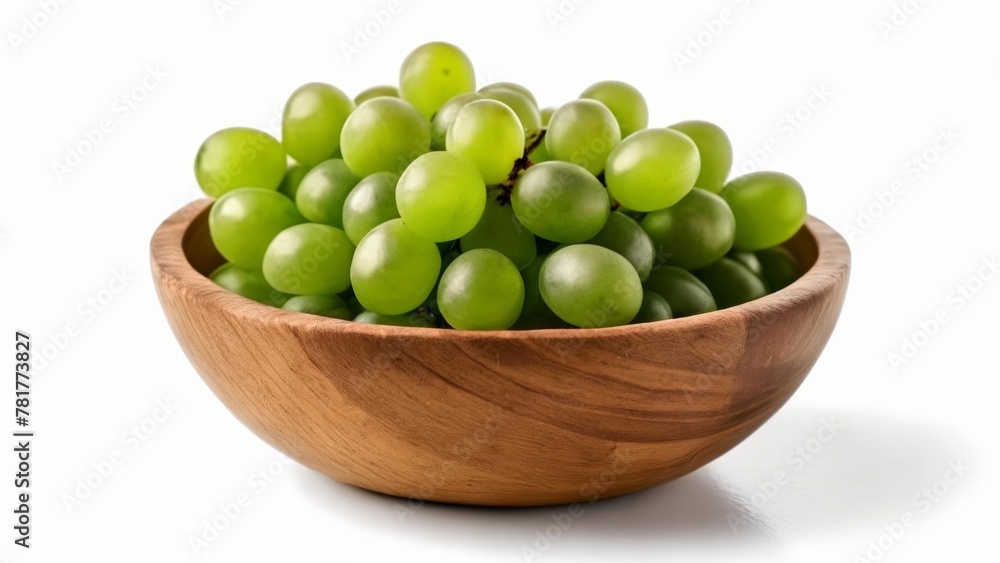 Fresh and vibrant green grapes in a wooden bowl Fresh and vibrant green grapes in a wooden bowl