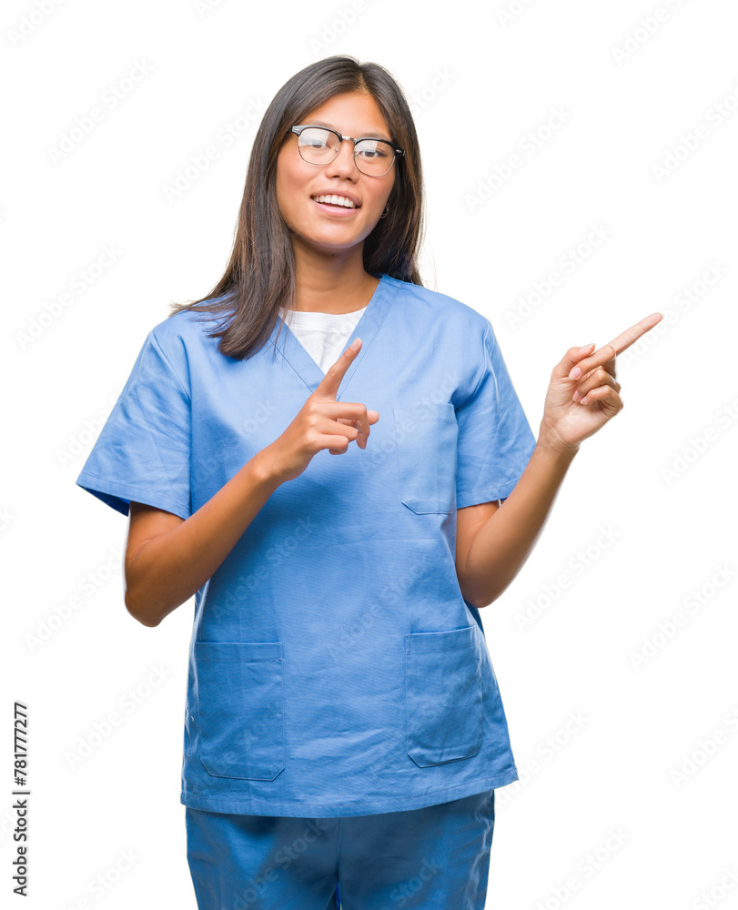 Young asian doctor woman over isolated background smiling and looking at the camera pointing with two hands and fingers to the side. Young asian doctor woman over isolated background smiling and looking at the camera pointing with two hands and fingers to the side.