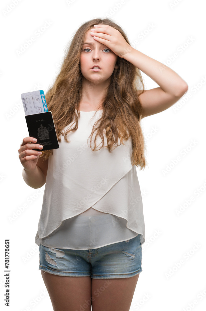 Young blonde woman holding passport of canada and boarding pass stressed with hand on head, shocked with shame and surprise face, angry and frustrated. Fear and upset for mistake. Young blonde woman holding passport of canada and boarding pass stressed with hand on head, shocked with shame and surprise face, angry and frustrated. Fear and upset for mistake.