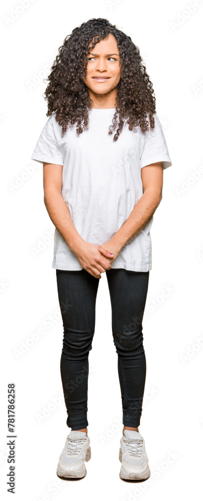 Obraz premium Young beautiful woman with curly hair wearing white t-shirt depressed and worry for distress, crying angry and afraid. Sad expression.