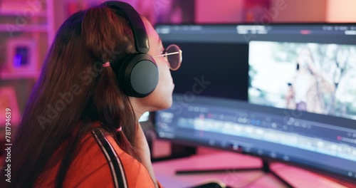 Computer, woman and video editor with headphones for digital editing, production and creative project. Videographer, desktop and music with technology for multimedia, filmmaking or content creation