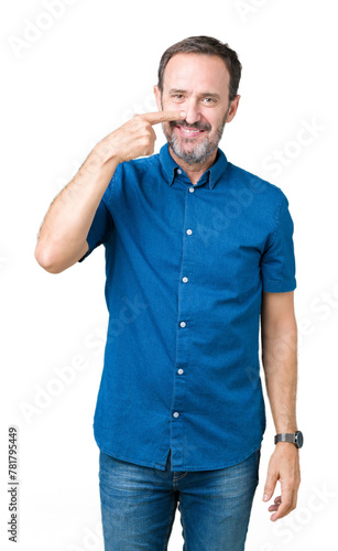 Handsome middle age elegant senior man over isolated background Pointing with hand finger to face and nose, smiling cheerful