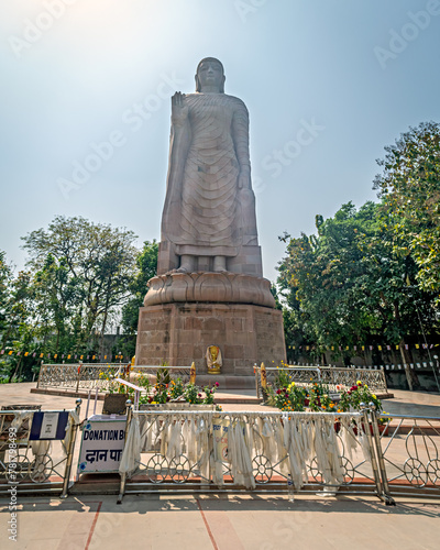 80 ft high sandstone made statue of standing Buddha made with joint efforts from India and Thiland is located in Sarnath near Varanasi photo