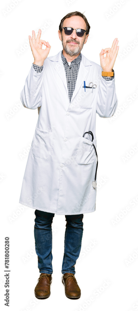 Handsome middle age doctor man wearing sunglasses relax and smiling with eyes closed doing meditation gesture with fingers. Yoga concept. Handsome middle age doctor man wearing sunglasses relax and smiling with eyes closed doing meditation gesture with fingers. Yoga concept.