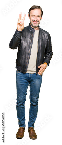 Middle age handsome man wearing black leather jacket showing and pointing up with fingers number three while smiling confident and happy.
