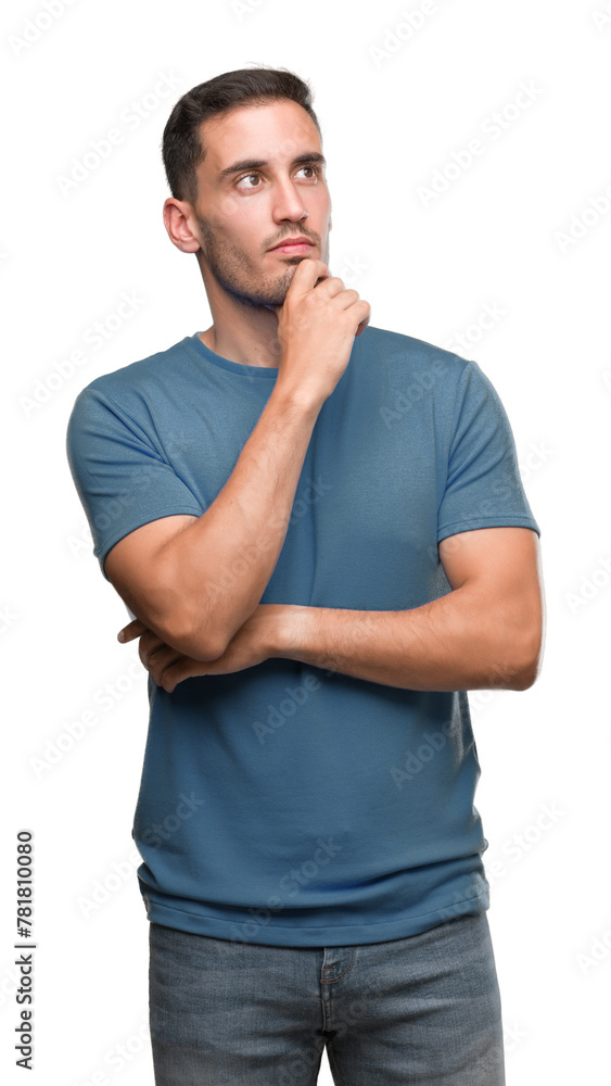 Handsome young casual man looking confident at the camera with smile with crossed arms and hand raised on chin. Thinking positive. Handsome young casual man looking confident at the camera with smile with crossed arms and hand raised on chin. Thinking positive.