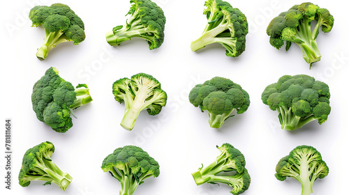 Top view of fresh broccoli florets neatly arranged on a white background, showcasing a variety of sizes from whole to small cuts. This image is perfect for highlighting healthy, green vegetables  photo
