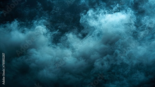  A substantial quantity of smoke appears in the middle of a monochrome photograph against a backdrop of a blue sky