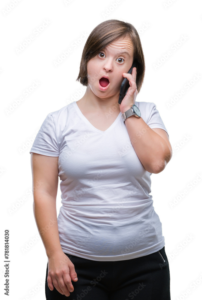 Young adult woman with down syndrome taking using smartphone over isolated background scared in shock with a surprise face, afraid and excited with fear expression Young adult woman with down syndrome taking using smartphone over isolated background scared in shock with a surprise face, afraid and excited with fear expression
