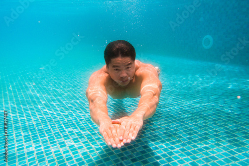Young athlete man in swimming pool. Swim exercise.