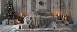 Studio decorations with Christmas rustic wooden bedroom interior in gray, white, silver colours with baldaquin bed, fake fur blanket, candles, Christmas fir tree and gifts on floor. Christmas morning