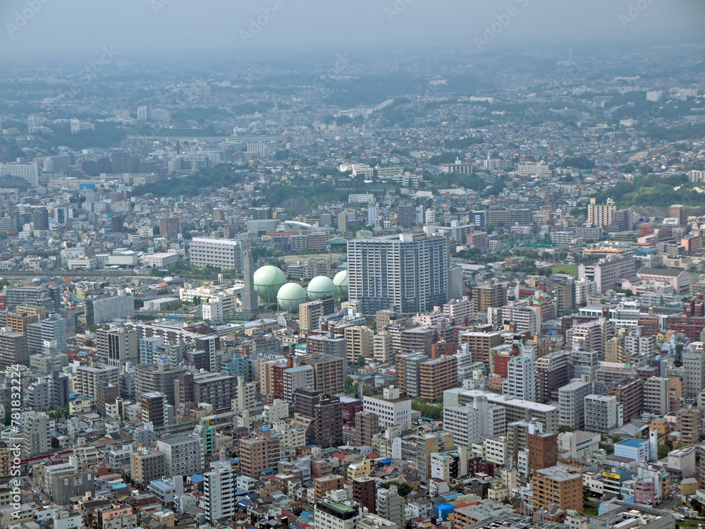 Liquefied natural gas storage tanks in urban cityscape aerial view, Yokohama