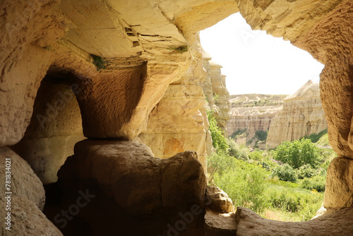 View out of a cave next to the trail leading through the Pigeon Valley, Güvercinlik Vadisi between Göreme and Uchisar, Cappadocia, Turkey