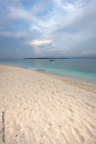 Turquoise water and pure white sand beach at the shore of famous Gili meno island in Lombok  Indonesia