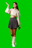 Woman in Skirt and Sweater Posing for Camera