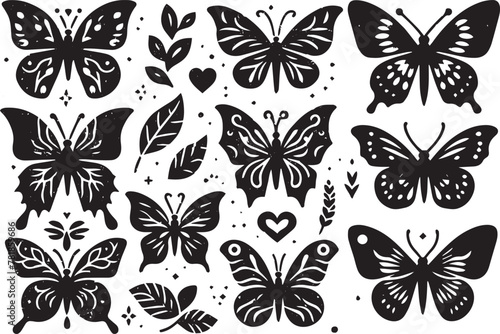 Free vector hand drawn butterflies silhouette set within white background.