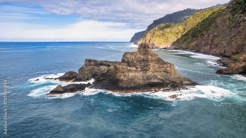 The majestic green mountains of Madeira rising above the crystal-clear, azure ocean; the natural beauty and wilderness of the island are breathtaking.