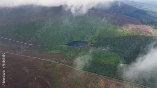 Top view of the lake in the middle of green mountains in 4k photo